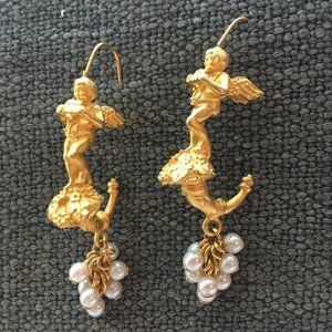 Gold plated and faux pearl angel earrings.